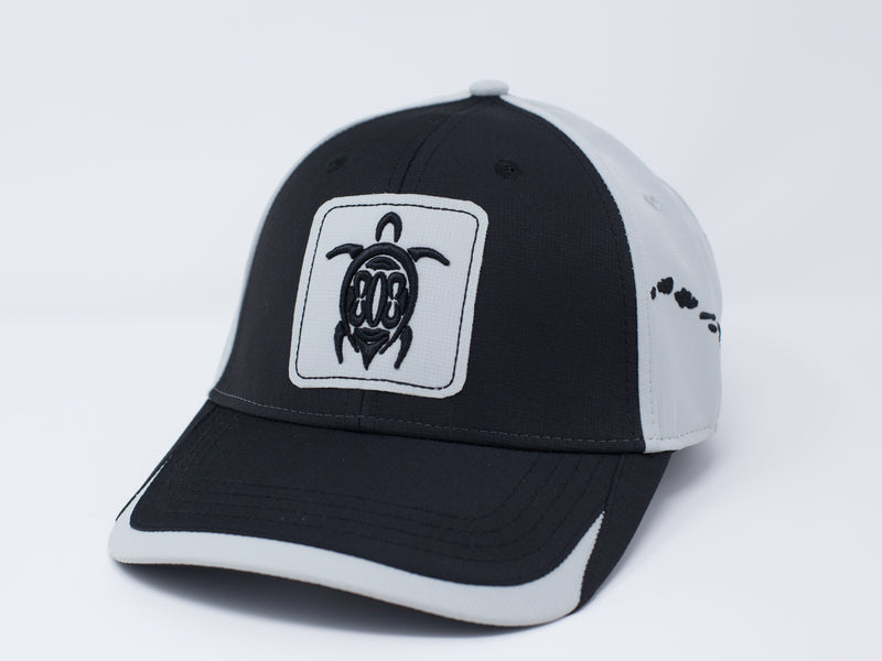 Black and gray sports cap. Turtle with 808 embroidered on front and Hawaiian islands on left side. Buckle Closure.