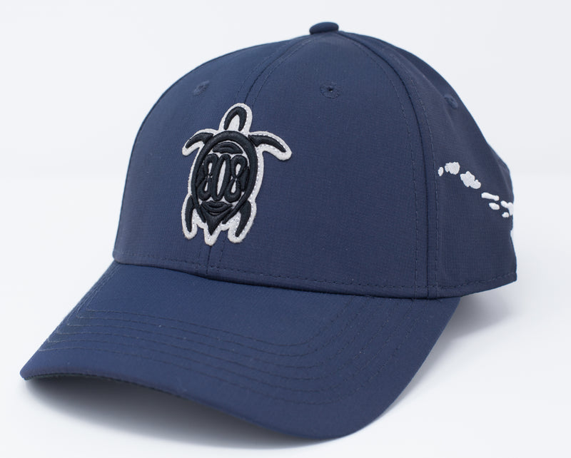 Navy blue colored sport material baseball cap with a turtle embroidery on the center front. Uses a buckle Closure.